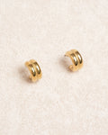 Aretes de metal dorado