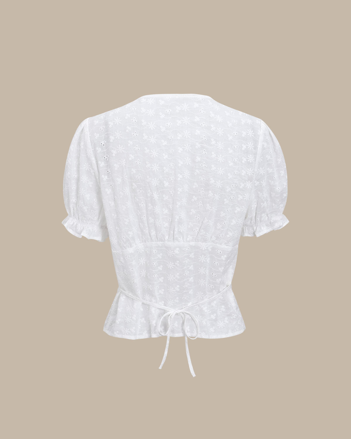 Blusa blanca floral con mangas abullonadas