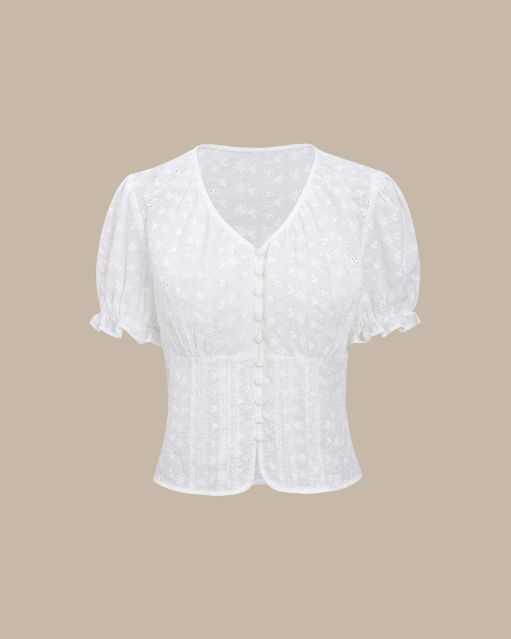 Blusa blanca floral con mangas abullonadas