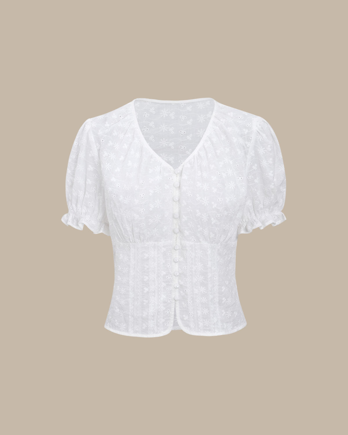 Blusa blanca floral con mangas abullonadas