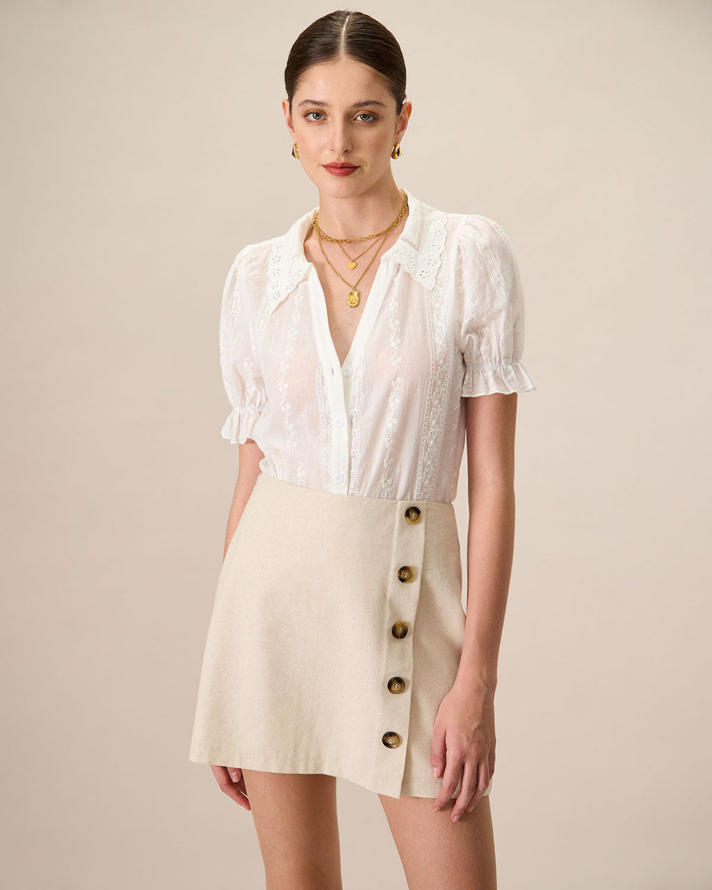 Minifalda de algodón beige de tiro alto con botones para mujer