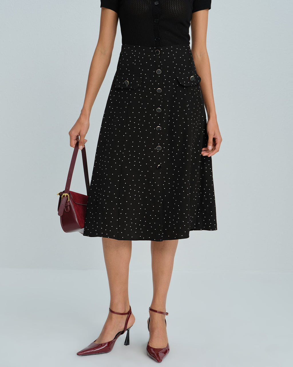 Falda midi negra de lunares
